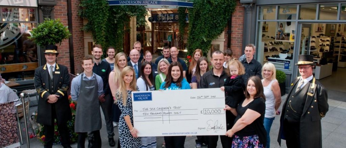 Shopping centre staff celebrate reaching their fundraising target Shopping centre staff celebrate reaching their fundraising target